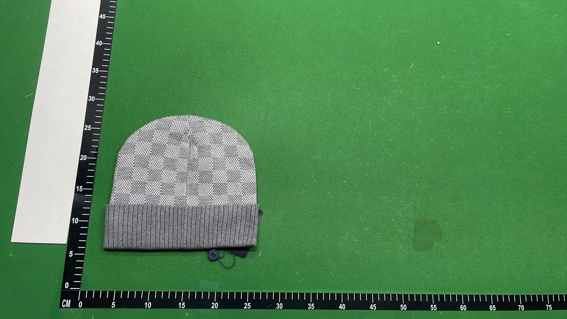 Black Knit Beanie with Patterned Design and Metal Tag