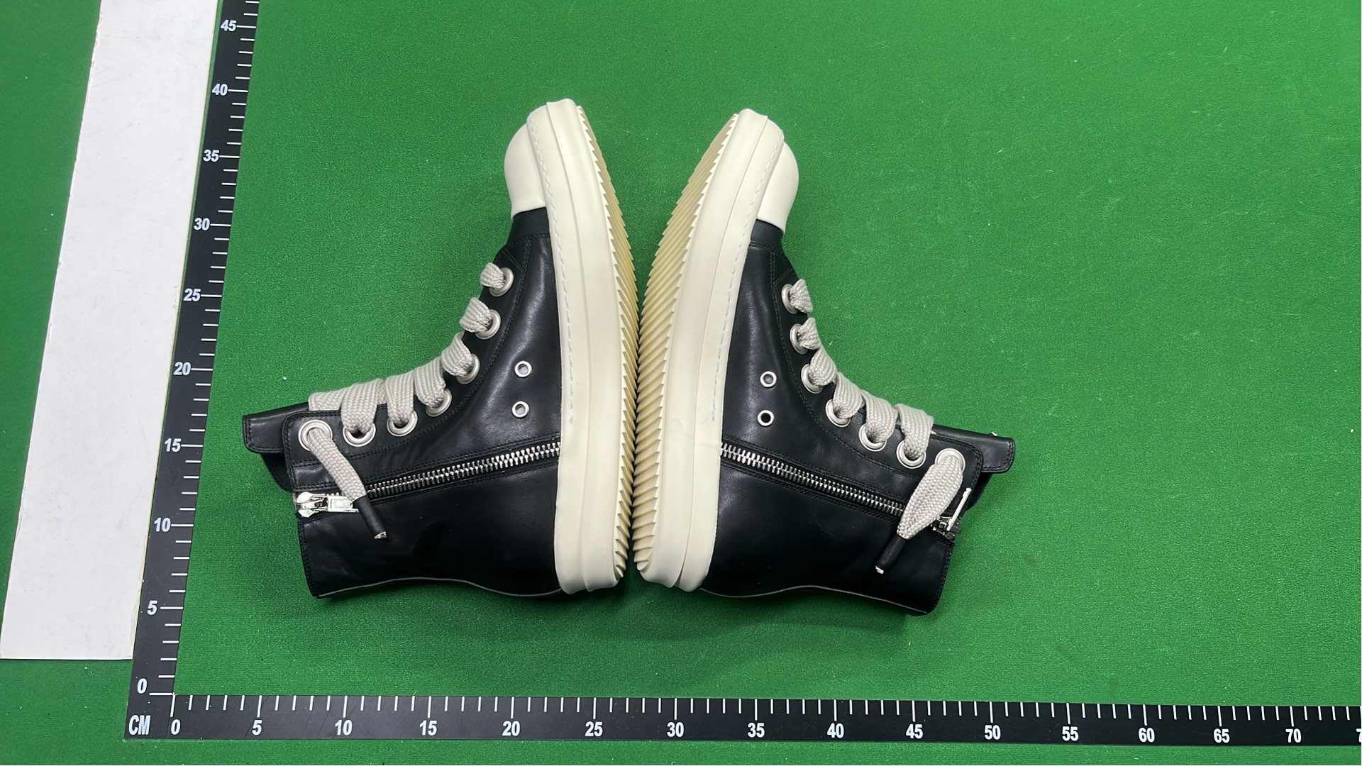 Black High-Top Sneakers with White Laces and Sole