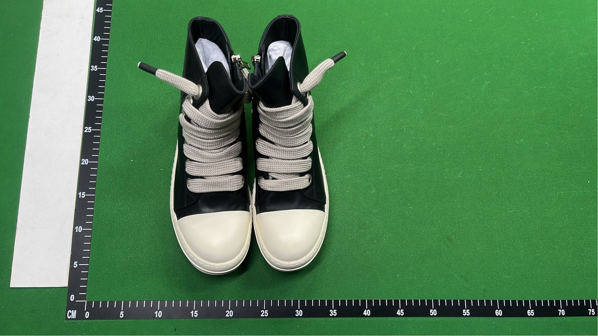 Black High-Top Sneakers with White Laces and Sole