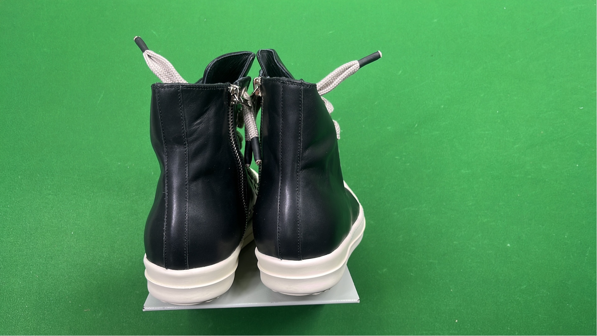 Black High-Top Sneakers with White Laces and Sole