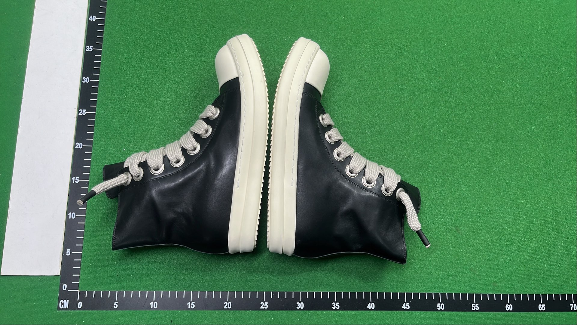 Black High-Top Sneakers with White Laces and Sole