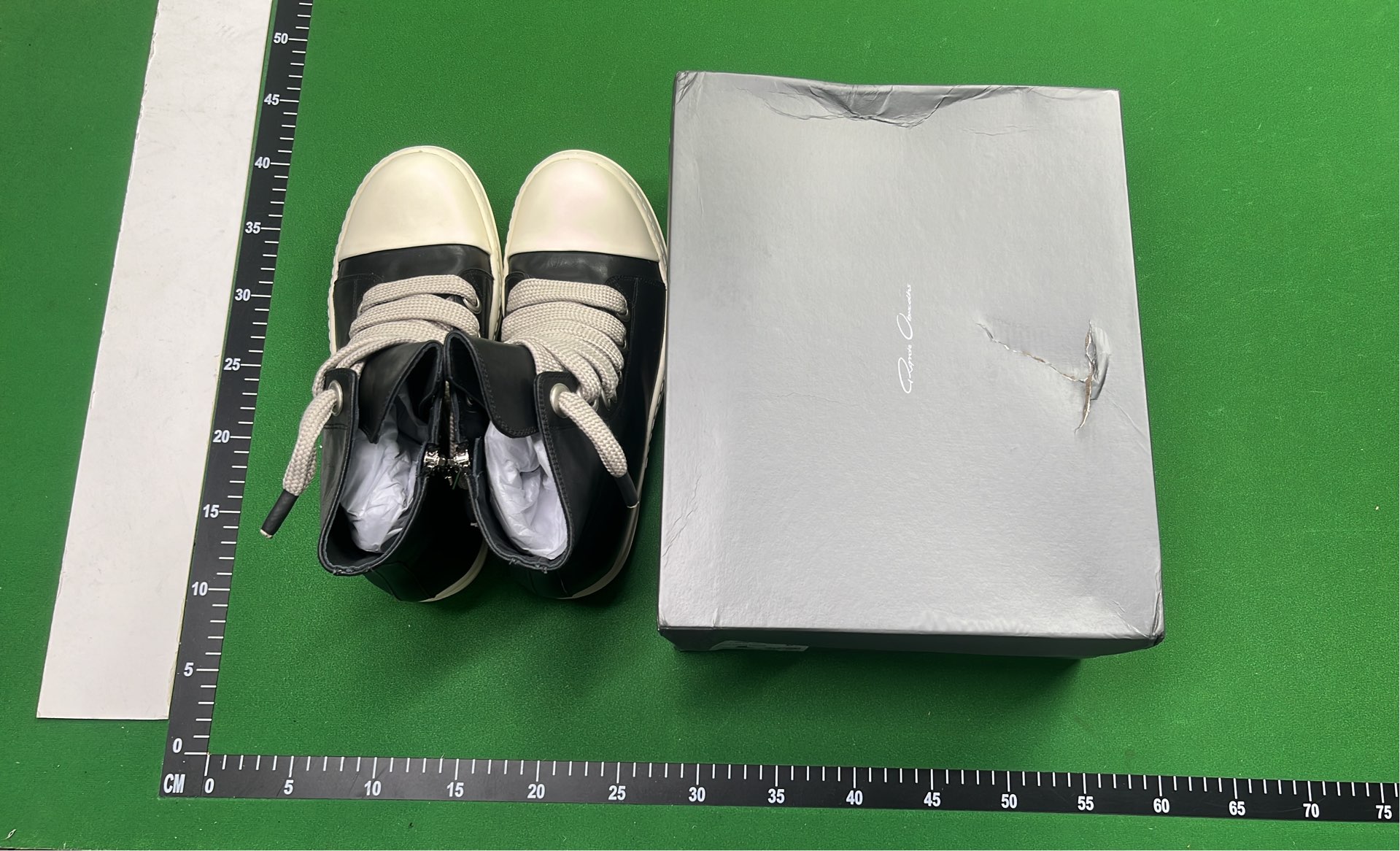 Black High-Top Sneakers with White Laces and Sole