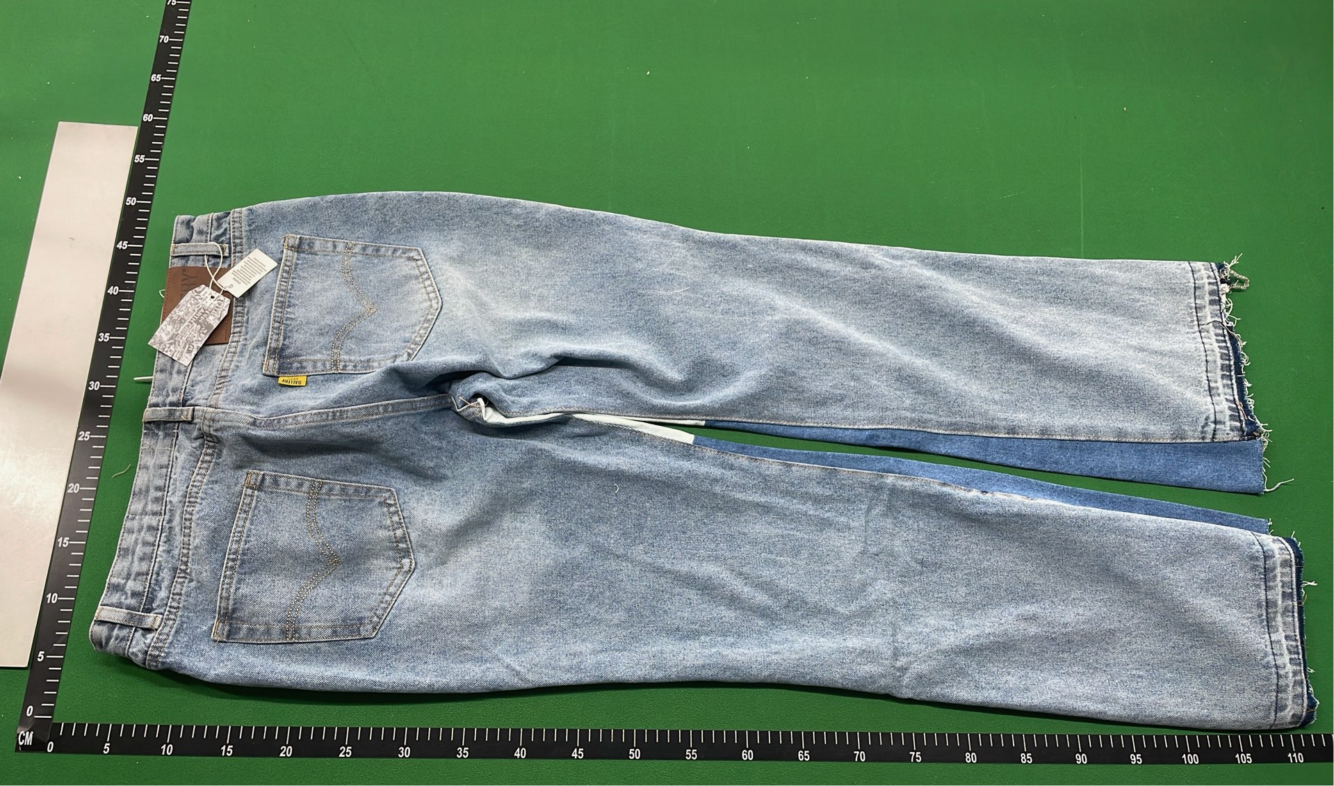 Vintage Patchwork Denim Jeans with Frayed Hem and Cream Accents