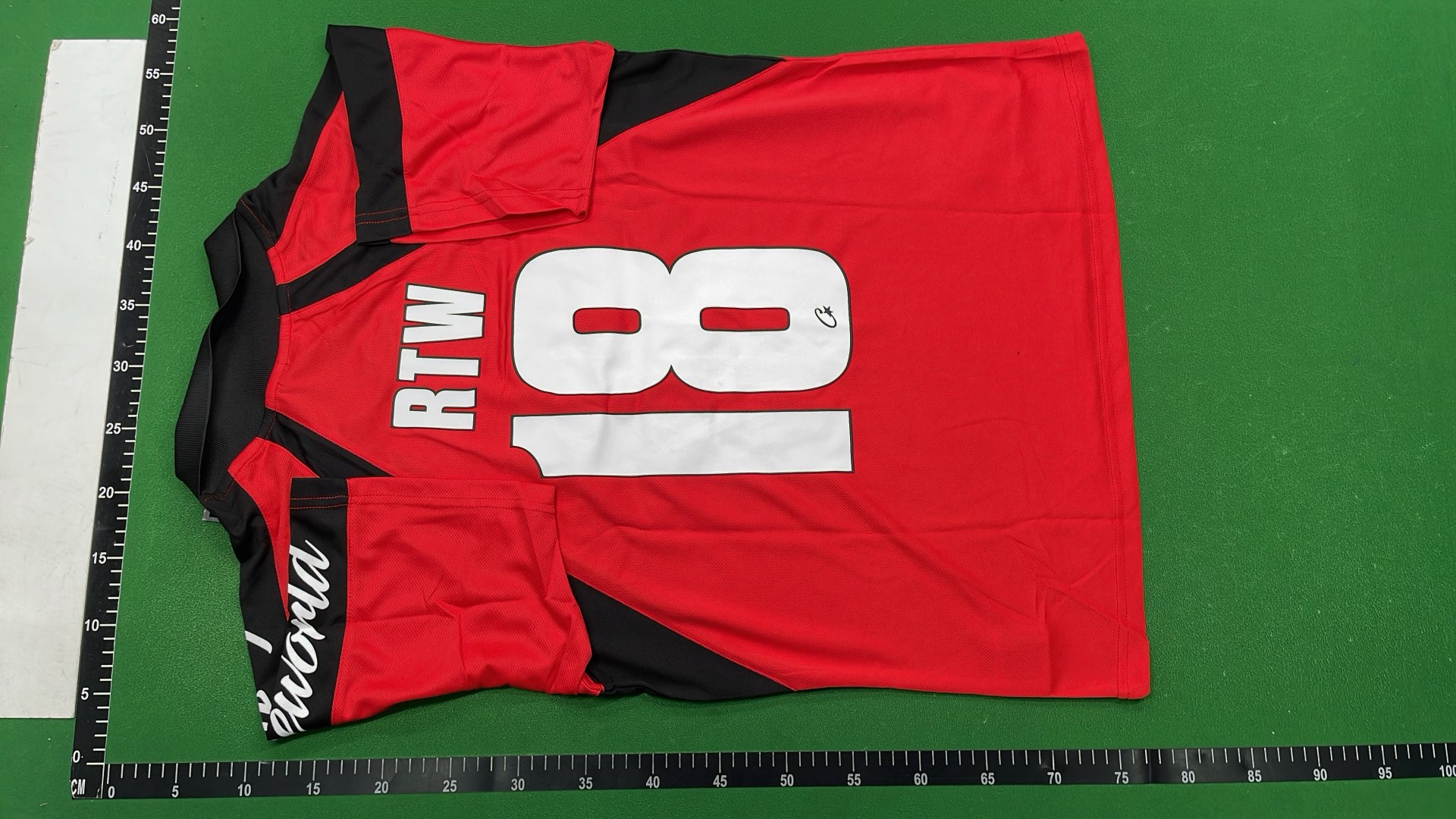 Red and Black Cortez Jersey with 'rulestheworld' Sleeve Design