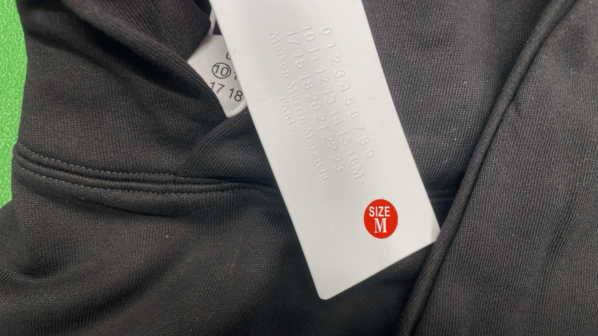 Black Hoodie with Number Pattern Design