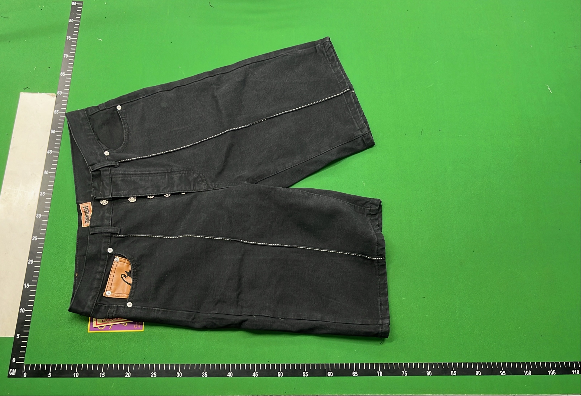 Black Denim Shorts with White Oval Logo Design