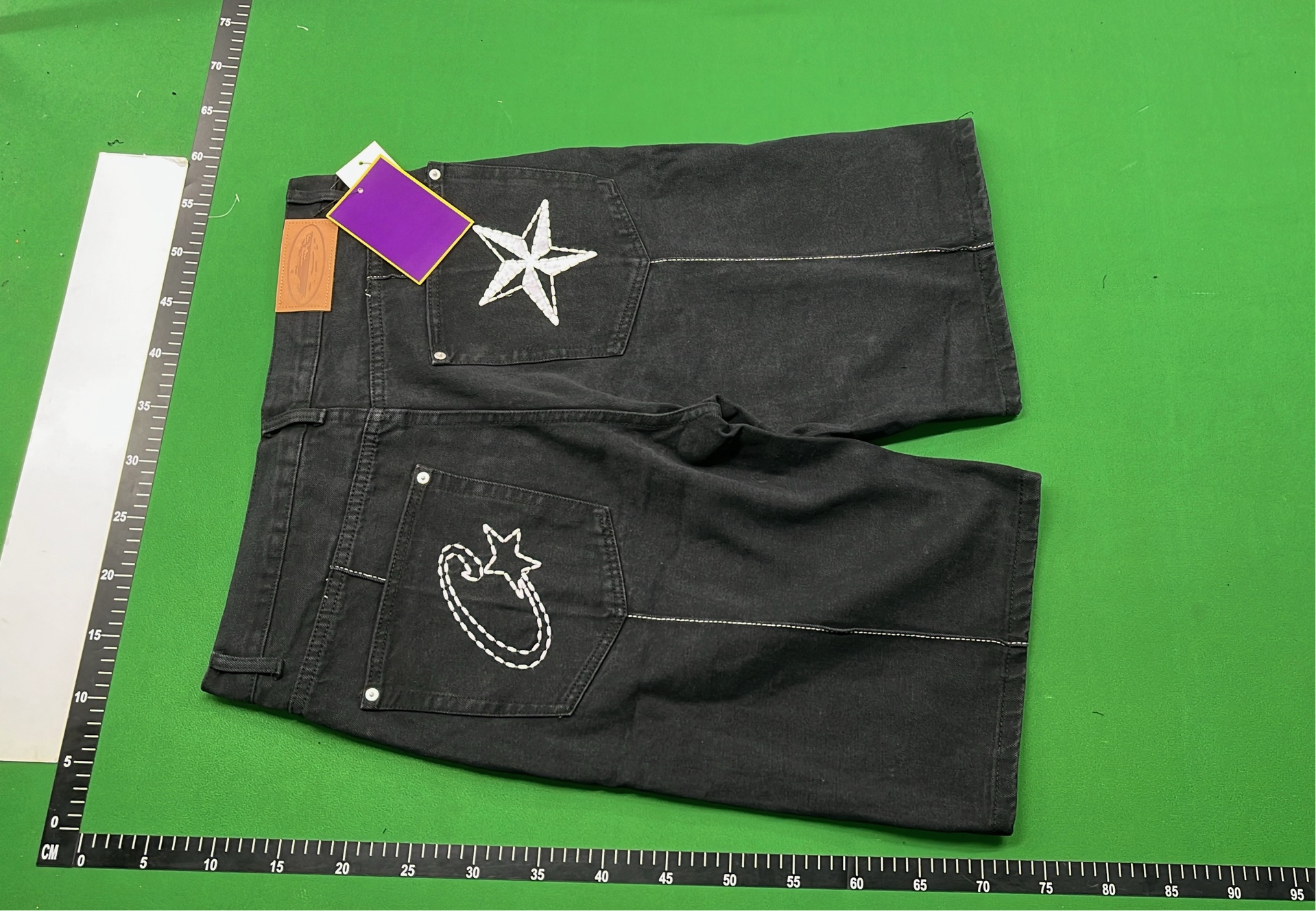 Black Denim Shorts with White Oval Logo Design