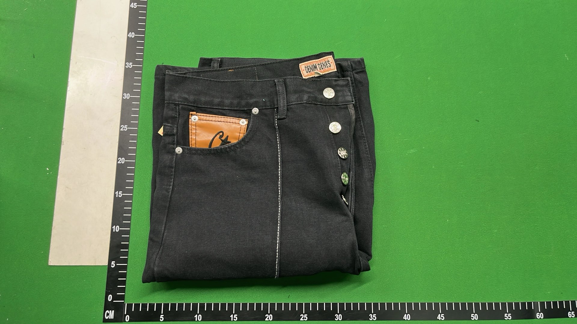 Black Denim Shorts with White Oval Logo Design