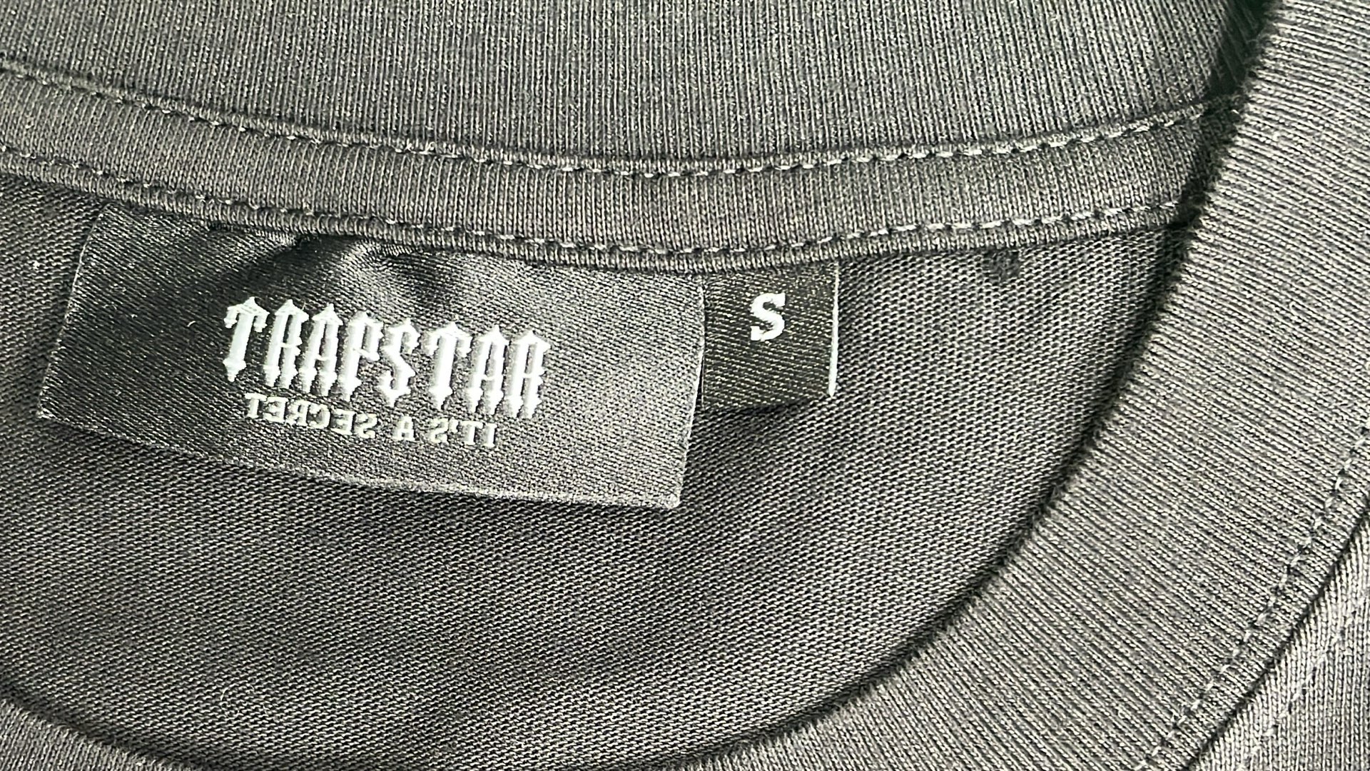 Trap Star Black T-Shirt with Purple Graphic Design
