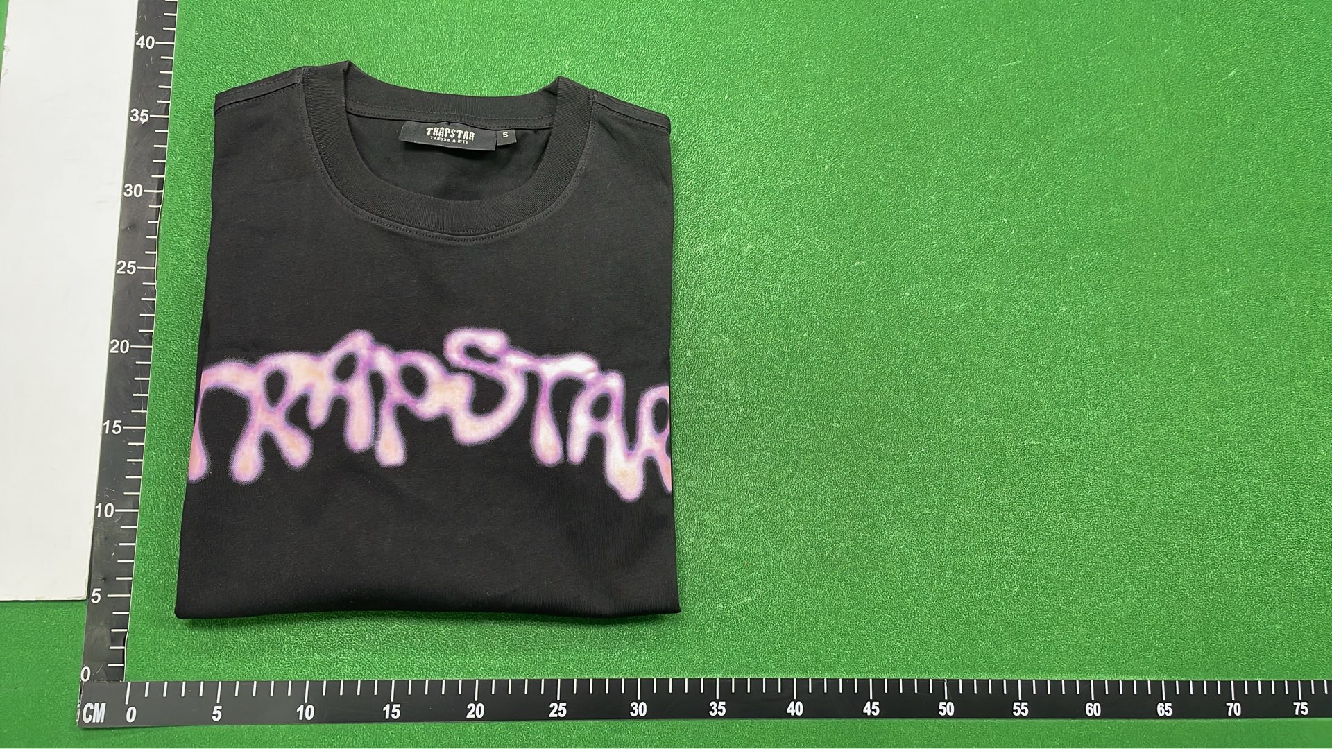Trap Star Black T-Shirt with Purple Graphic Design