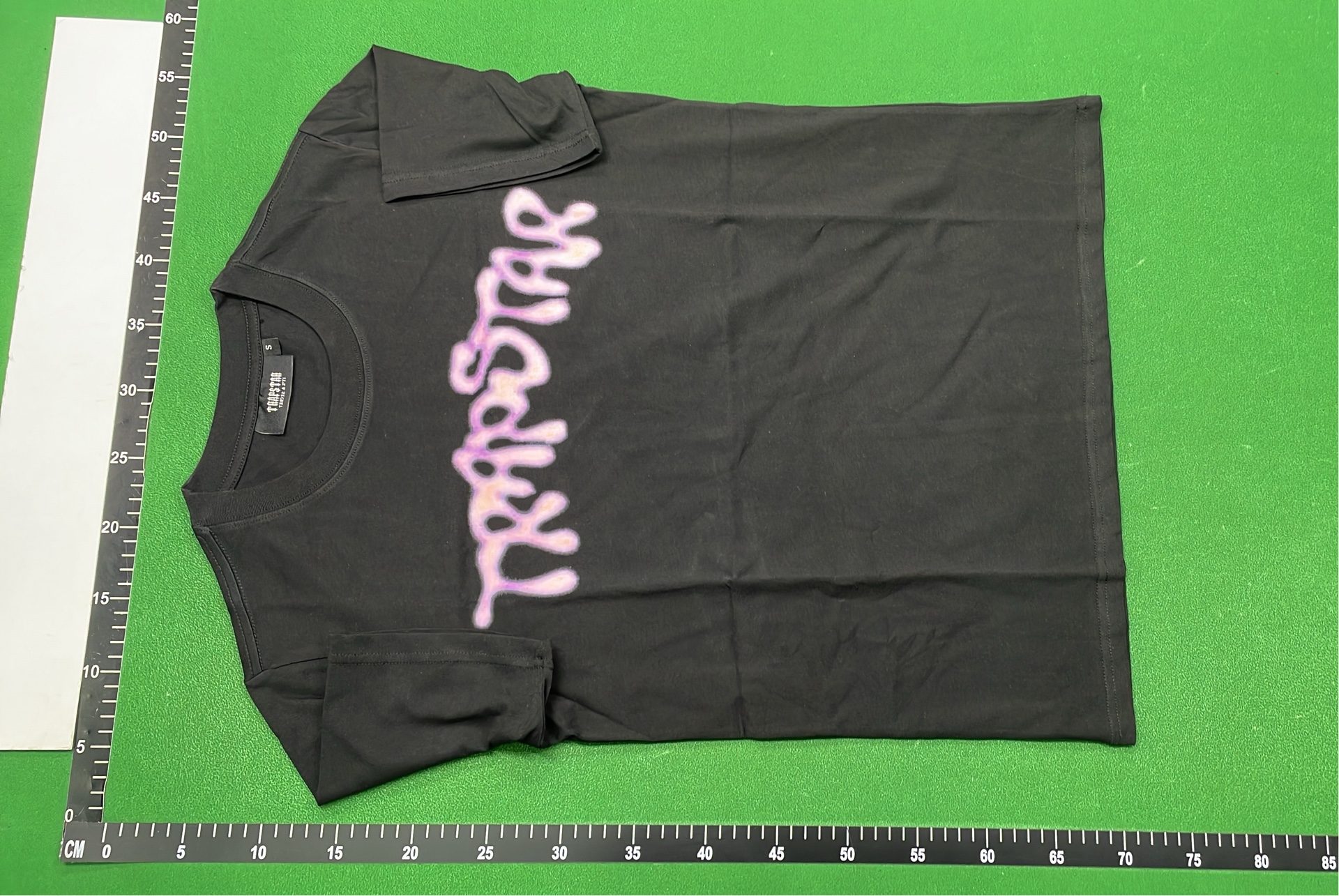 Trap Star Black T-Shirt with Purple Graphic Design
