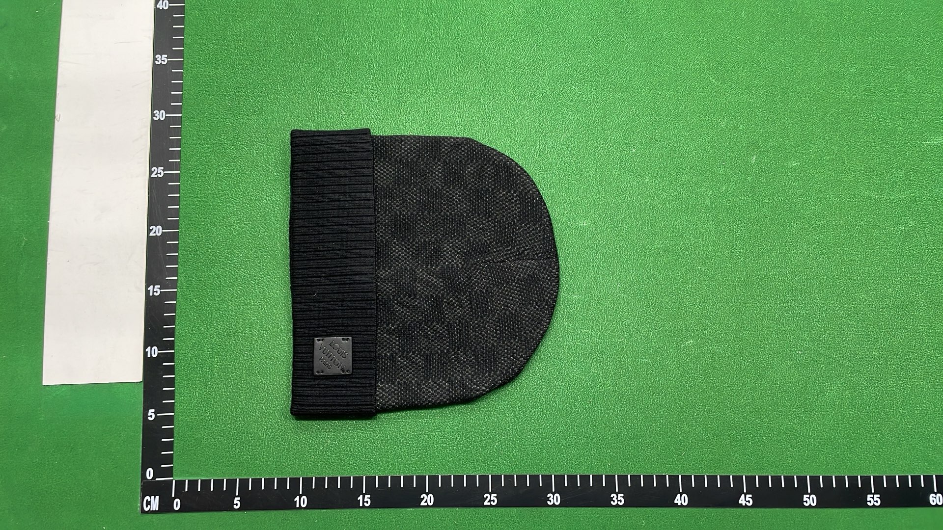 Black Knit Beanie with Patterned Design and Metal Tag