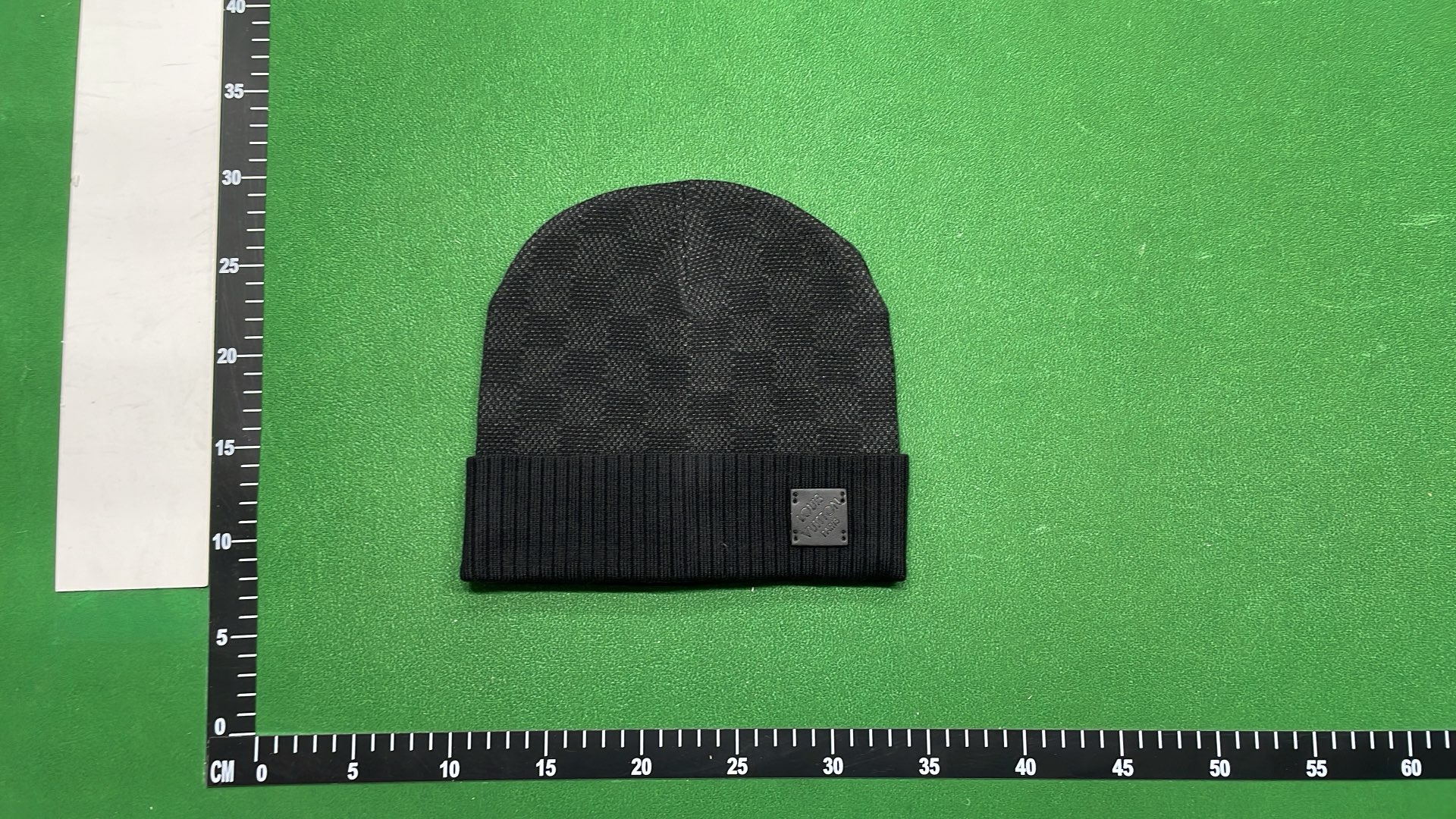 Black Knit Beanie with Patterned Design and Metal Tag