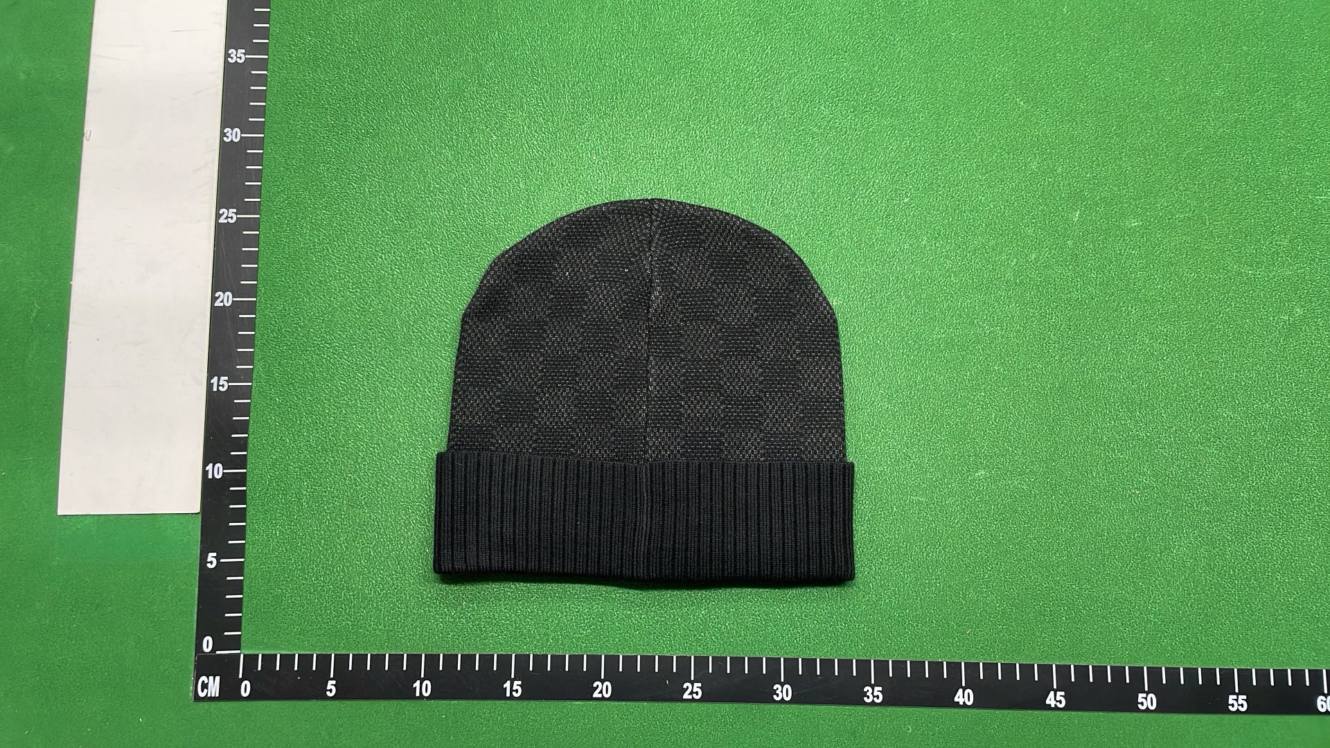 Black Knit Beanie with Patterned Design and Metal Tag