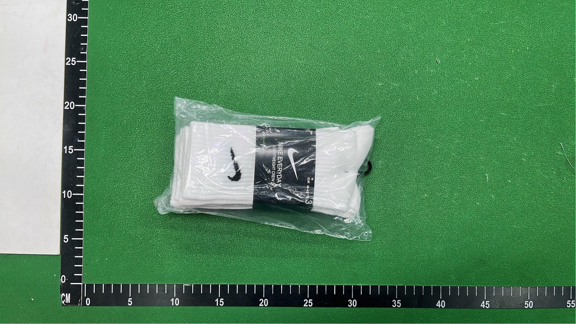Nike Black Socks with White Swoosh Logo