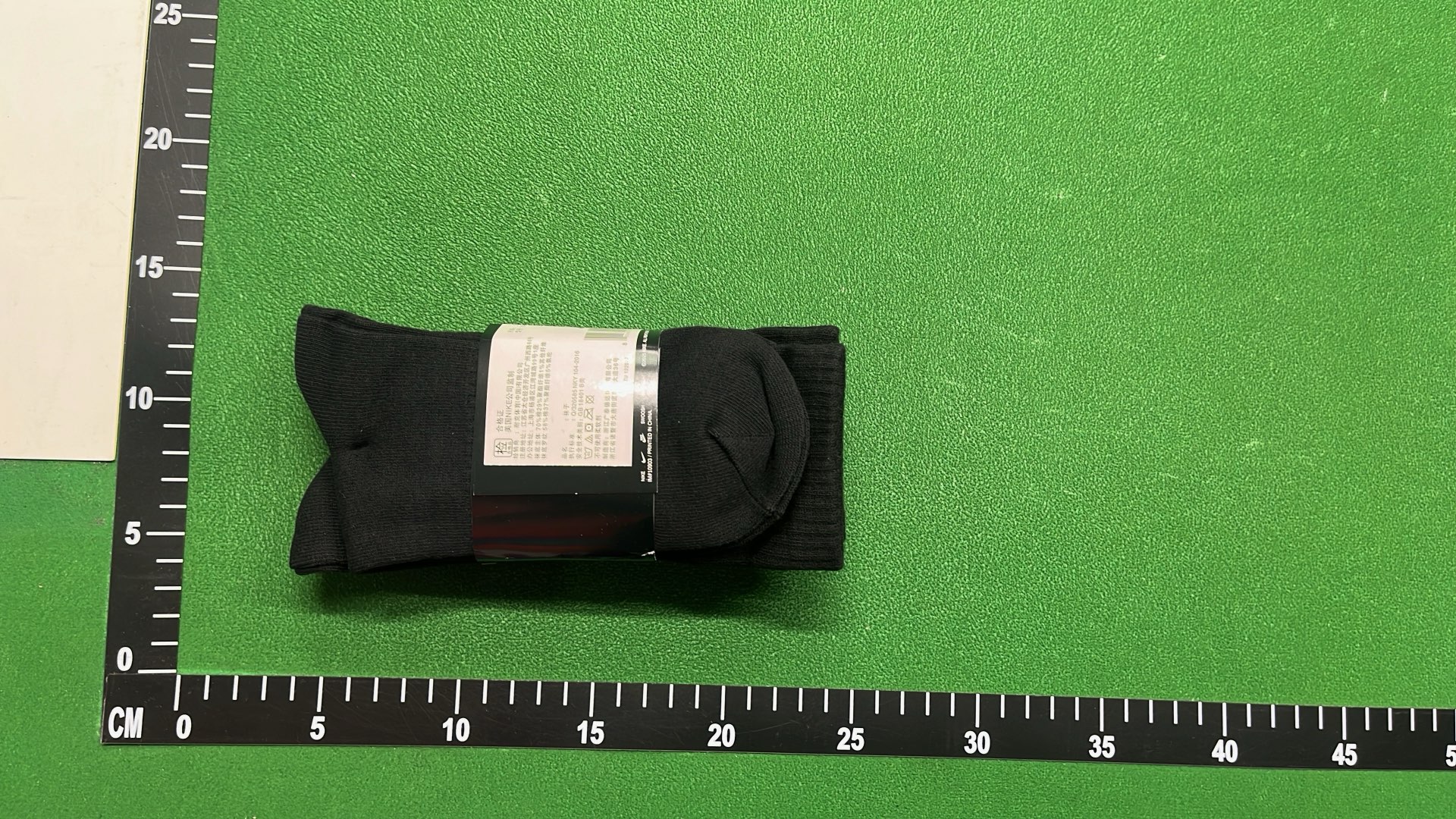 Nike Black Socks with White Swoosh Logo