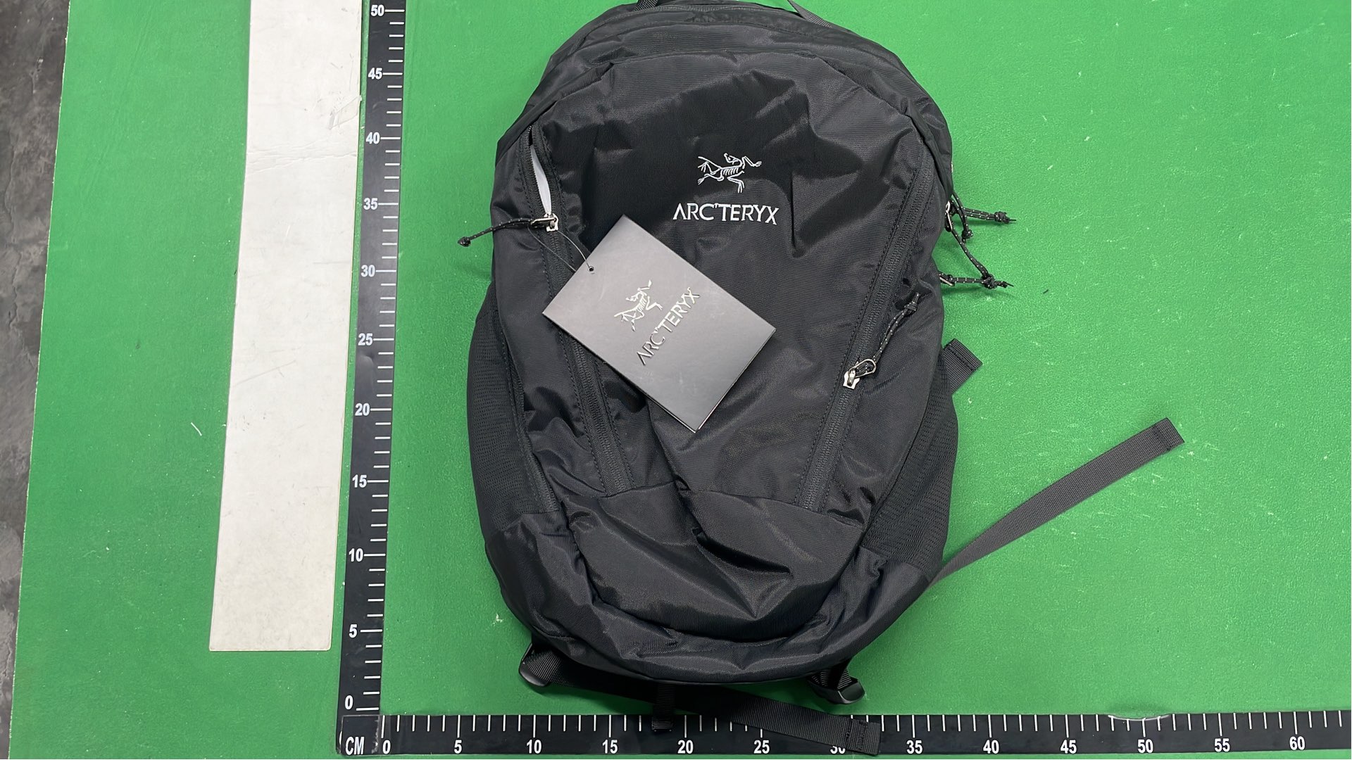 Arc'teryx Black Backpack with Yellow Logo