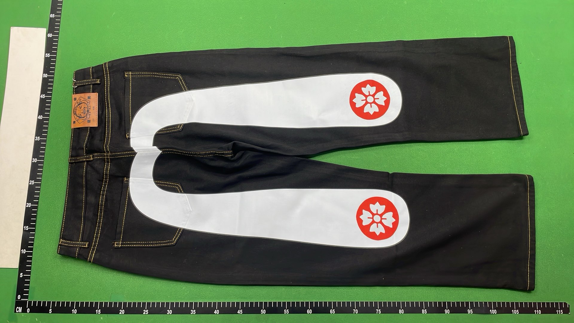 Evisu Denim Pants with Unique Back Patch Designs
