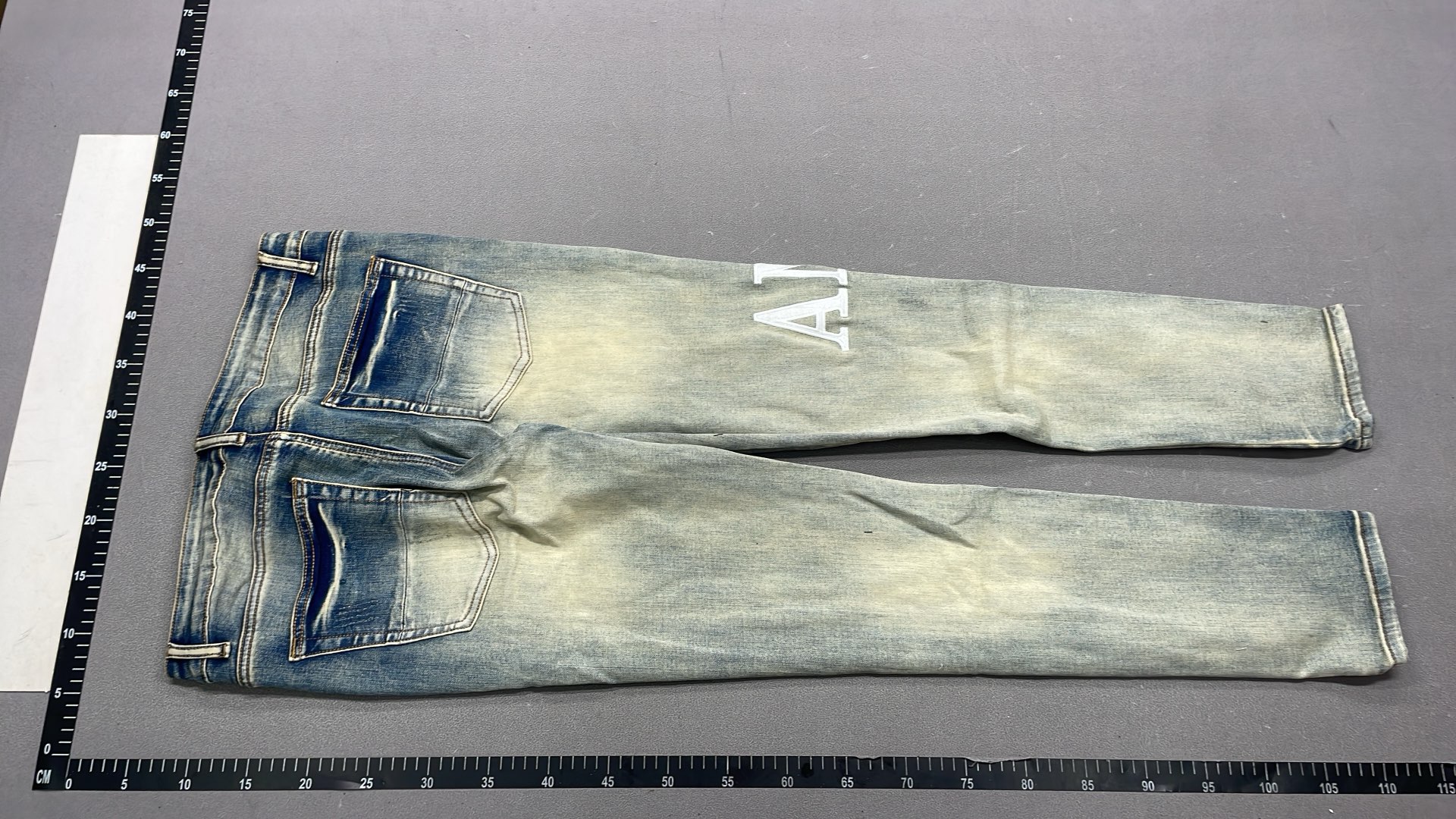 Men's Black Distressed Denim Jeans with Colorful Paint Drip Design