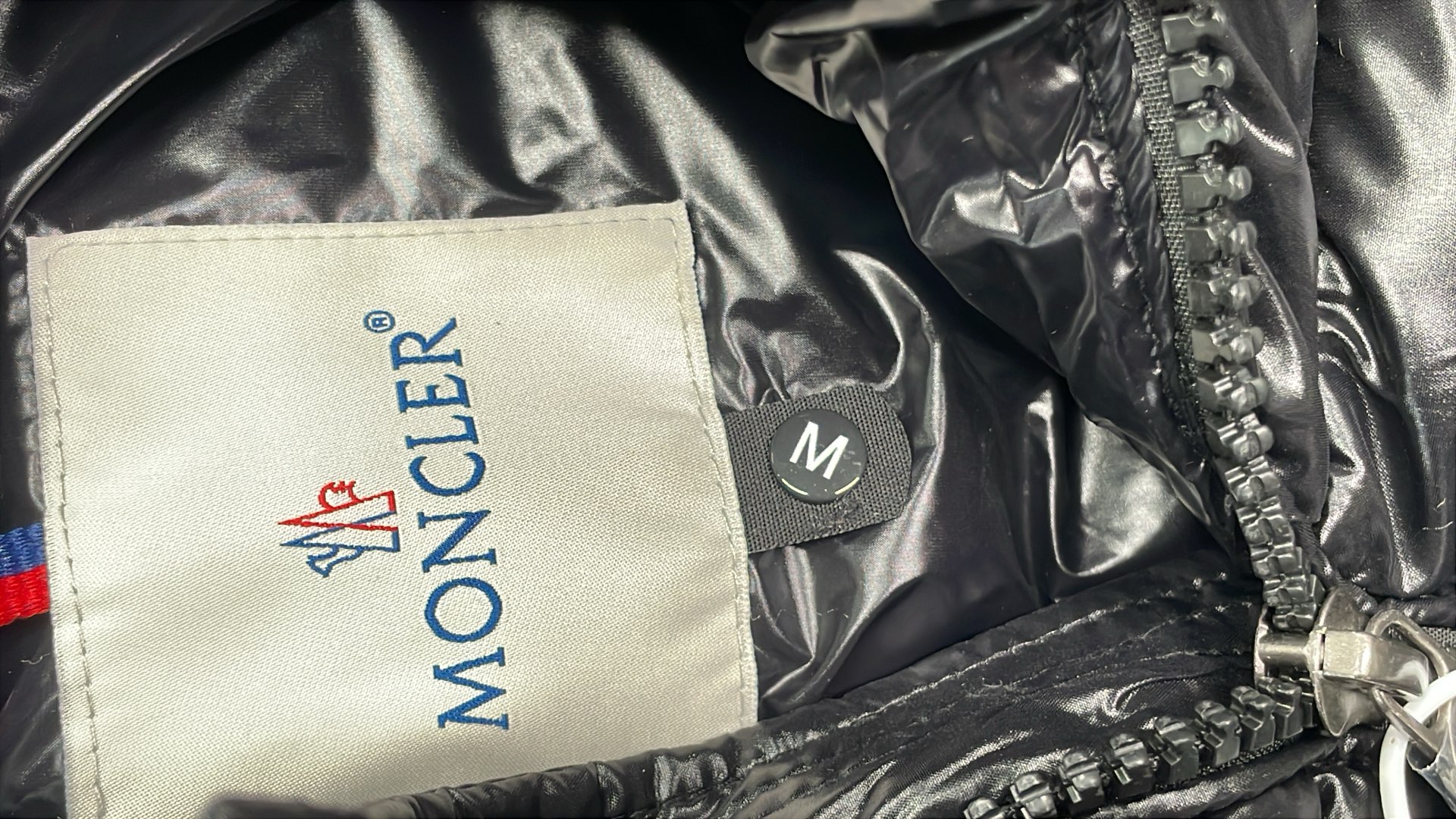 Black Moncler Down Jacket with Hood and Zip Closure