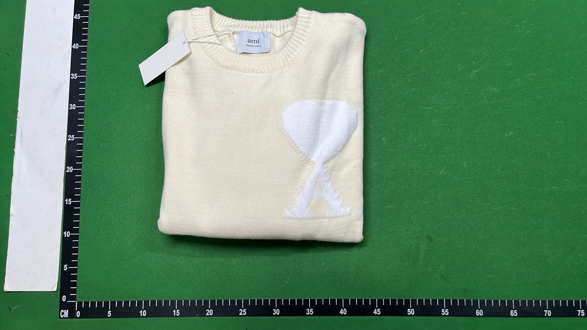 Black Sweater with Red Heart Logo