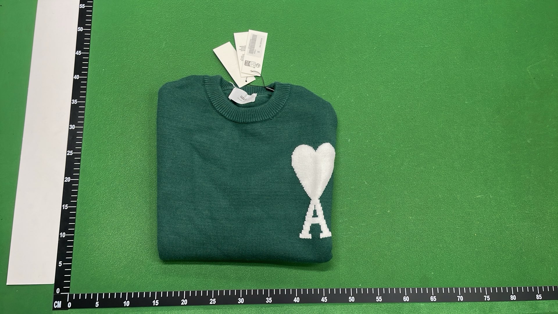 Black Sweater with Red Heart Logo