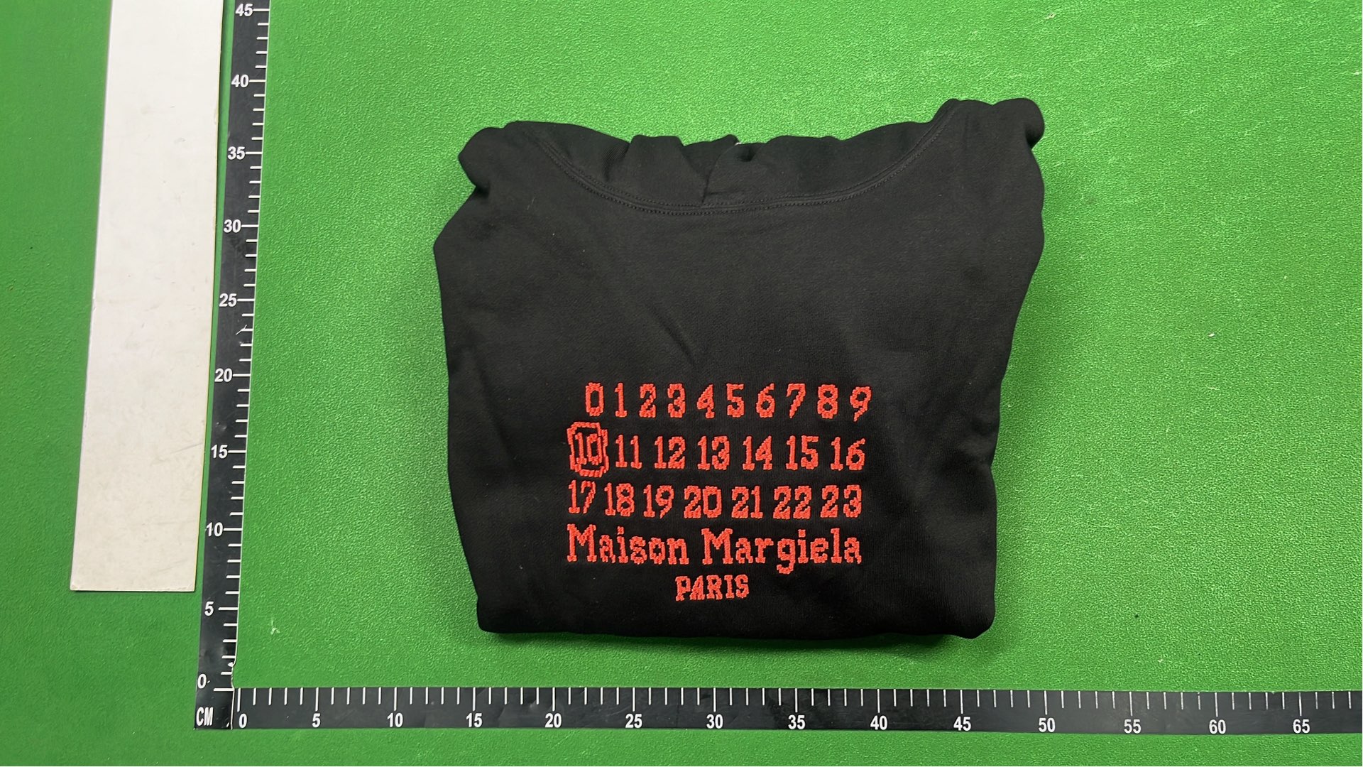 Black Hoodie with Number Pattern Design