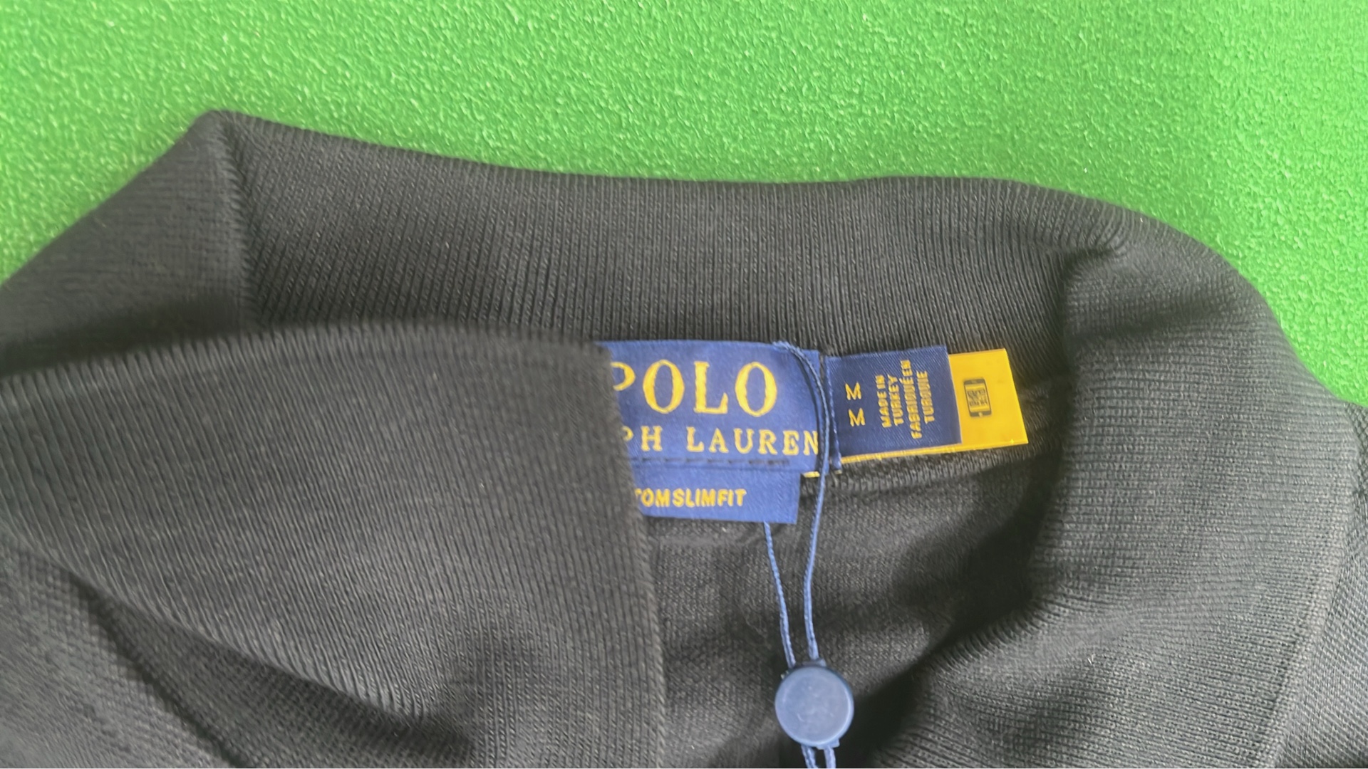 Black Polo Shirt with Gold Pony Logo