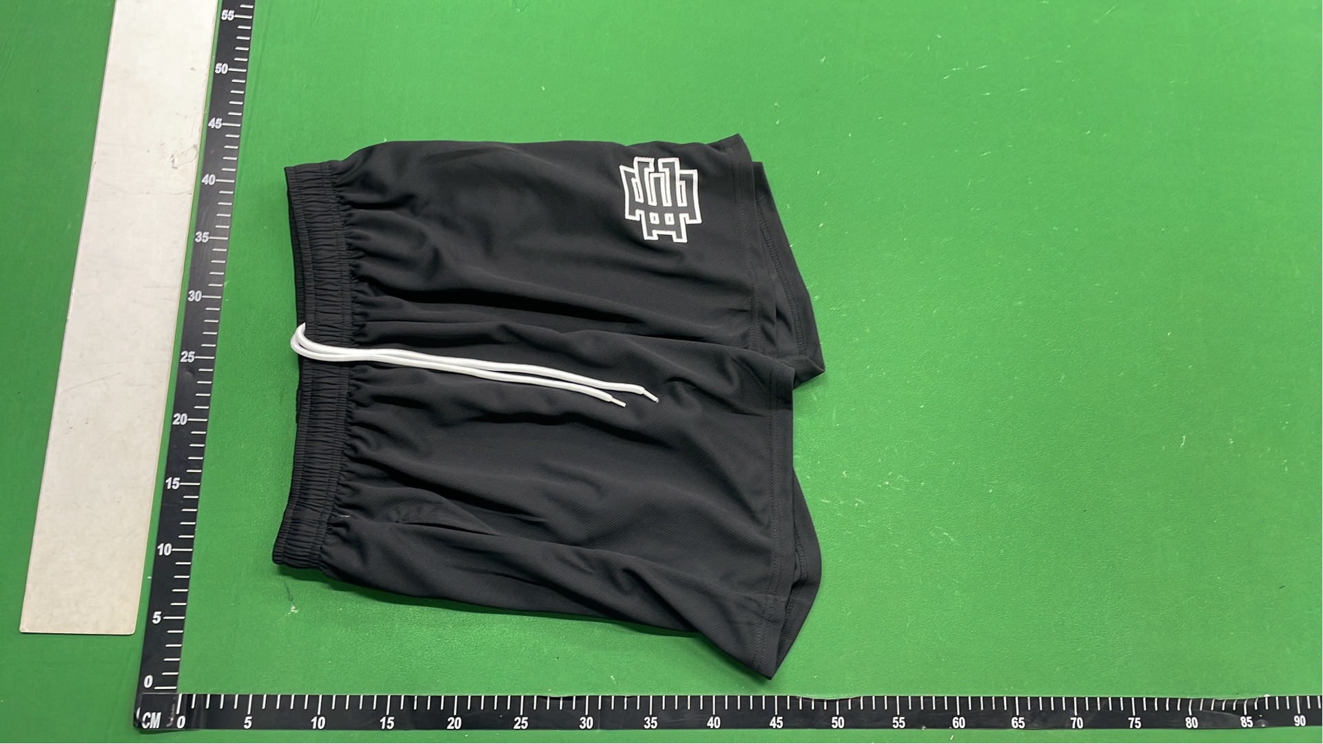 Vibrant Green Mesh Shorts with Logo Design