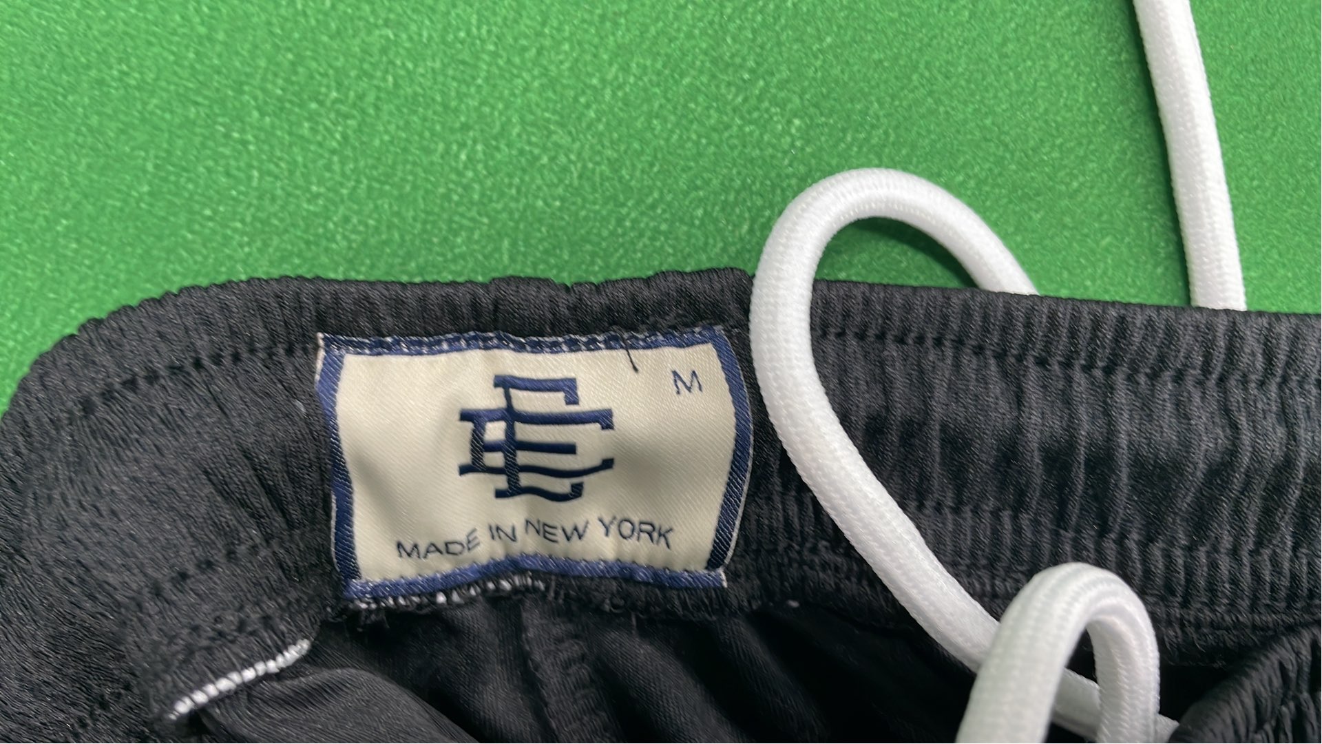 Vibrant Green Mesh Shorts with Logo Design