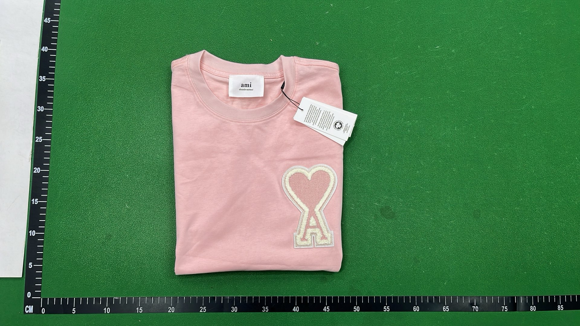 White T-Shirt with Red Heart Logo by alexandre mattiussi
