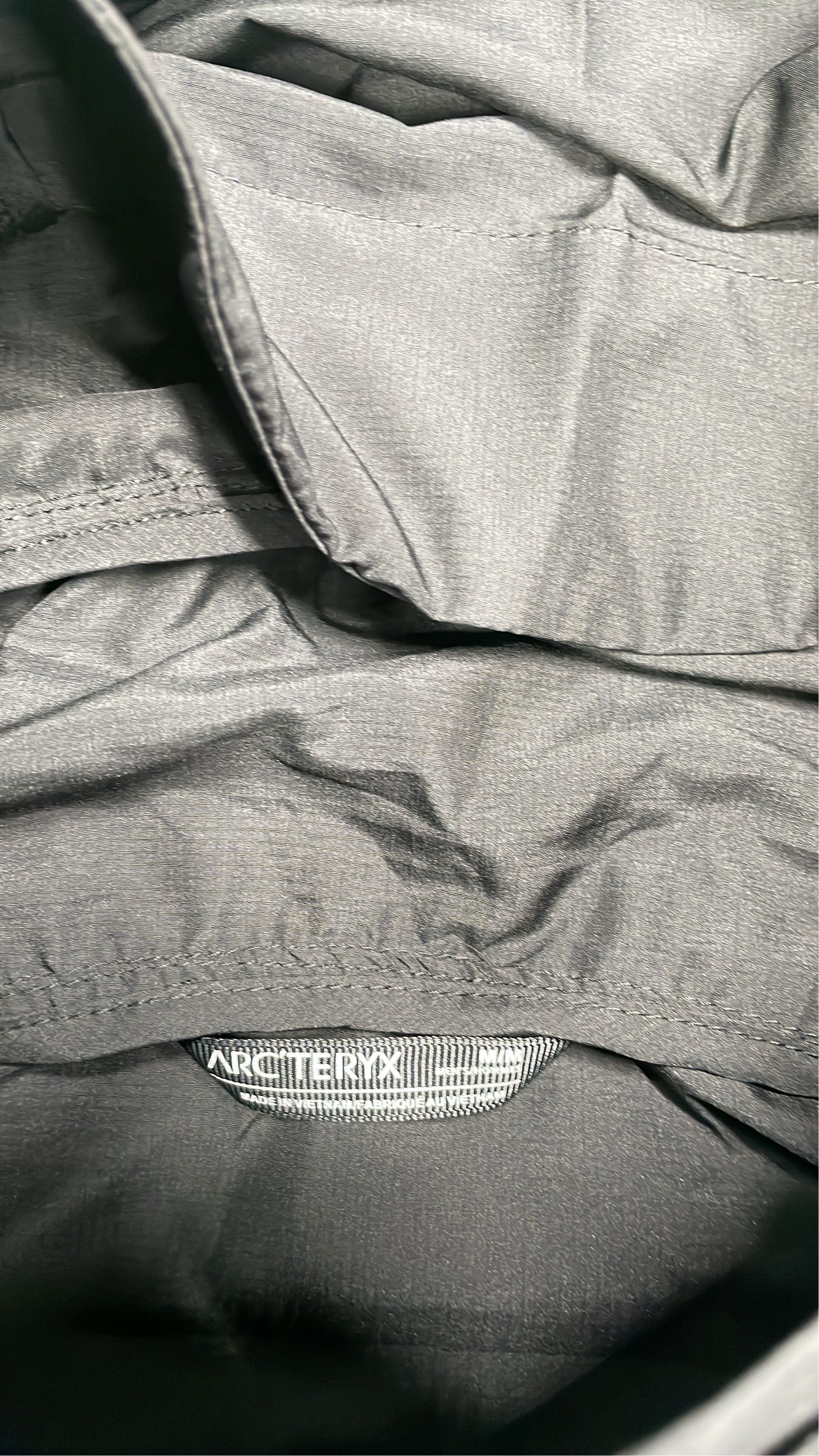 Arc'teryx Black Hooded Jacket for Outdoor Activities