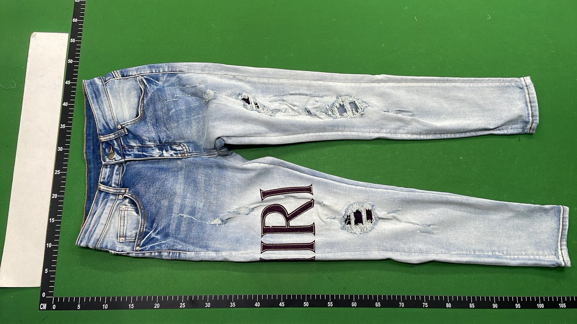 Men's Black Distressed Denim Jeans with Colorful Paint Drip Design