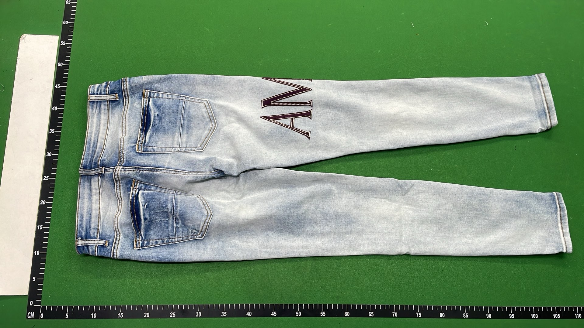 Men's Black Distressed Denim Jeans with Colorful Paint Drip Design