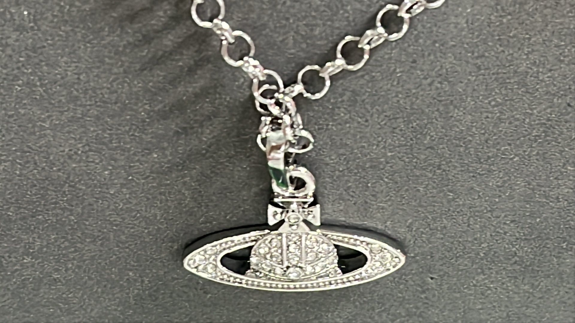 Gold Saturn Pendant Necklace with Crystal Accents