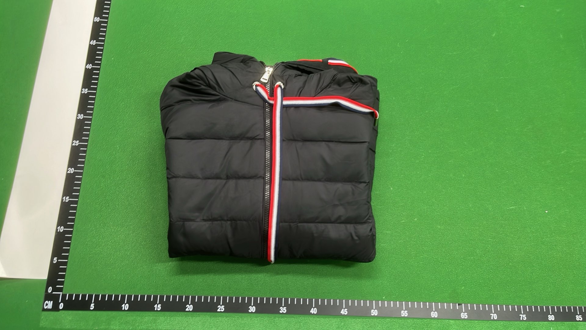Moncler Black Puffer Jacket with Ribbed Sleeves and High Collar