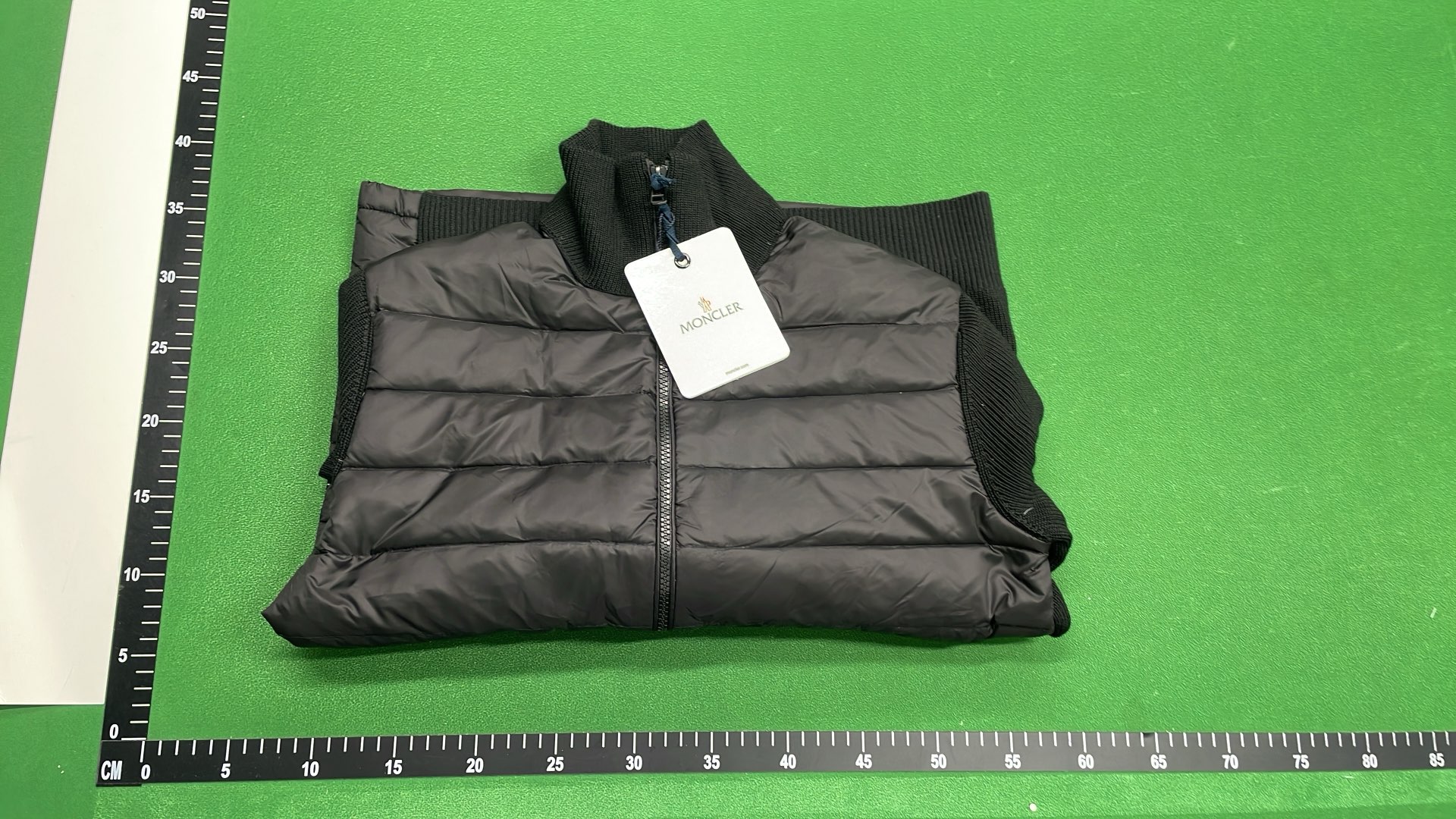 Moncler Black Puffer Jacket with Ribbed Sleeves and High Collar