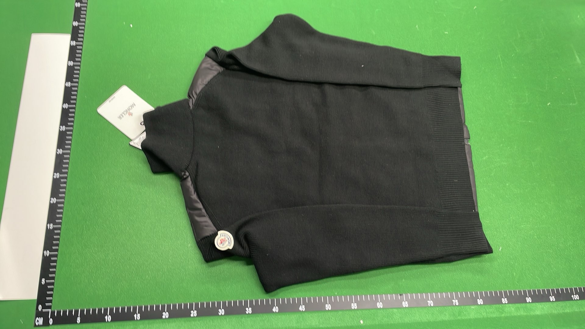 Moncler Black Puffer Jacket with Ribbed Sleeves and High Collar
