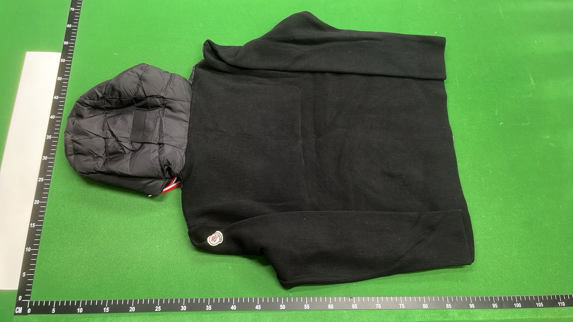 Moncler Black Puffer Jacket with Ribbed Sleeves and High Collar
