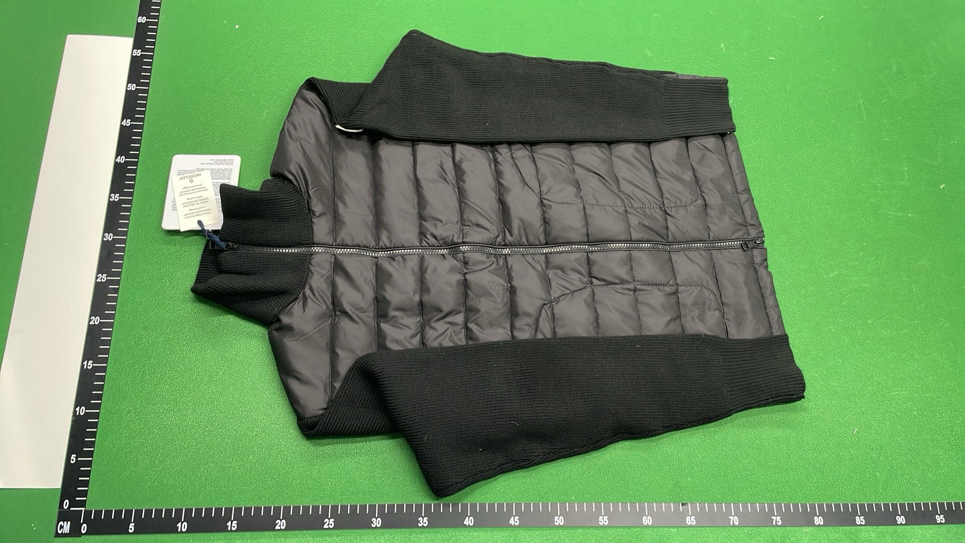 Moncler Black Puffer Jacket with Ribbed Sleeves and High Collar