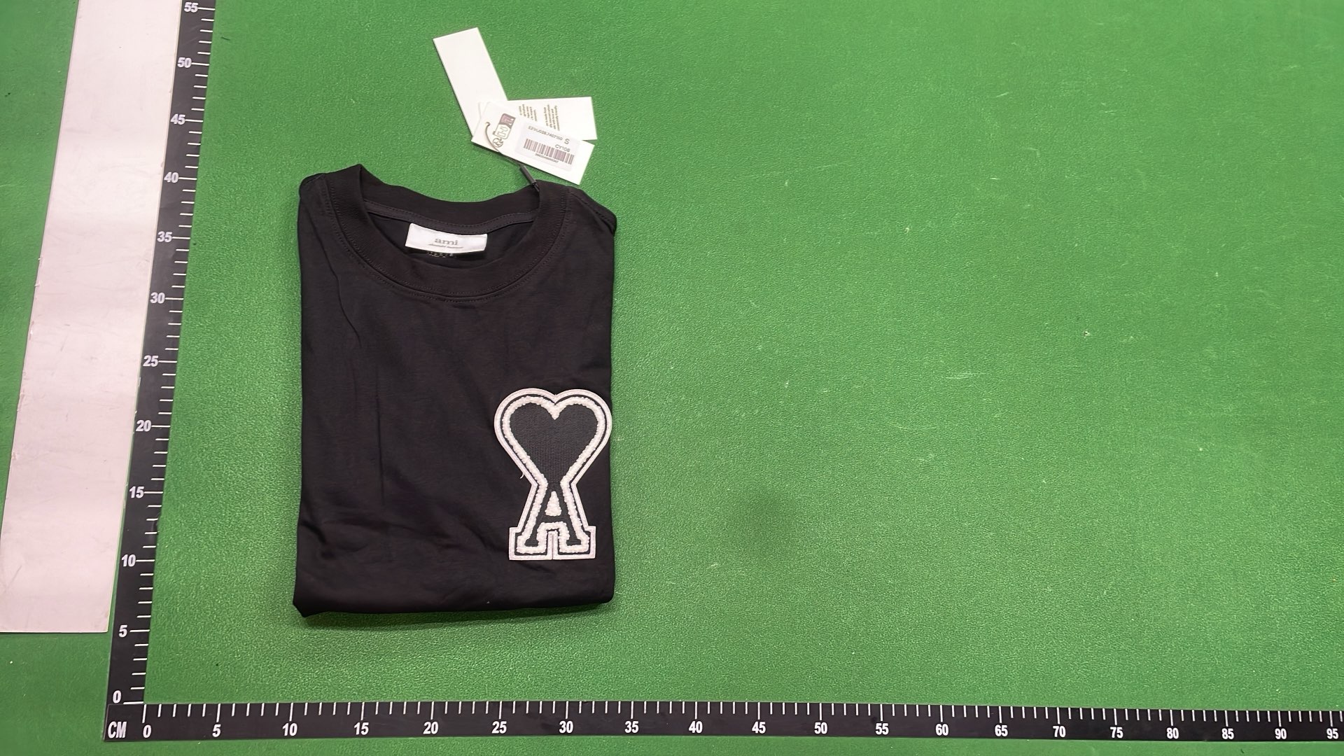 White T-Shirt with Red Heart Logo by alexandre mattiussi